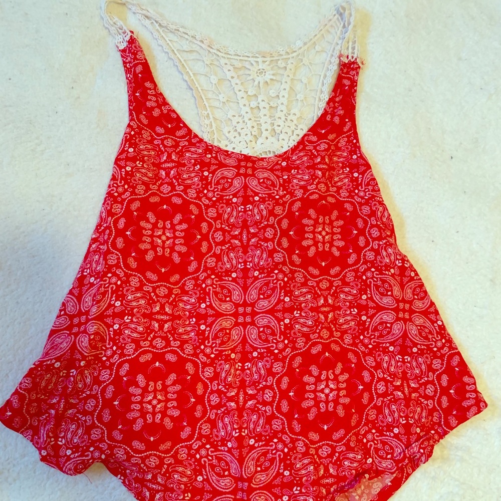 Red tank top with cute straps and a flowy finish!